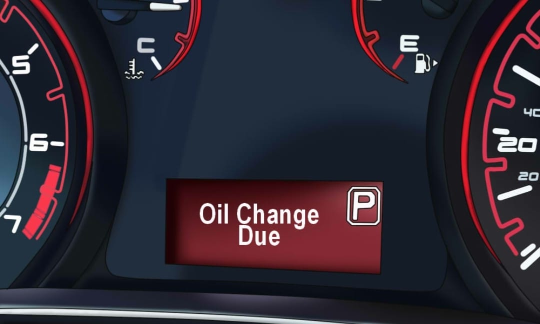 A close up of the oil change sign on a car